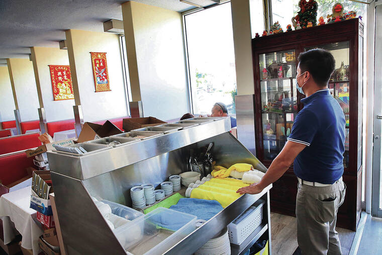 JAMM AQUINO / JAQUINO@STARADVERTISER.COM
                                Golden Duck restaurant owner Aaron Fong believes that his business, which relies heavily on kamaaina, remains depressed partly because of the requirement to show a COVID-19 vaccine card or negative test result.