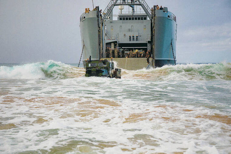 COURTESY U.S. MARINE CORPS
                                Hawaii Marines with 1st Battalion, 12th Marines drive a cargo truck ashore from a U.S. Army Logistics Support Vessel during Exercise Spartan Fury 21.1 on March 8 at the Pacific Missile Range Facility on Kauai.