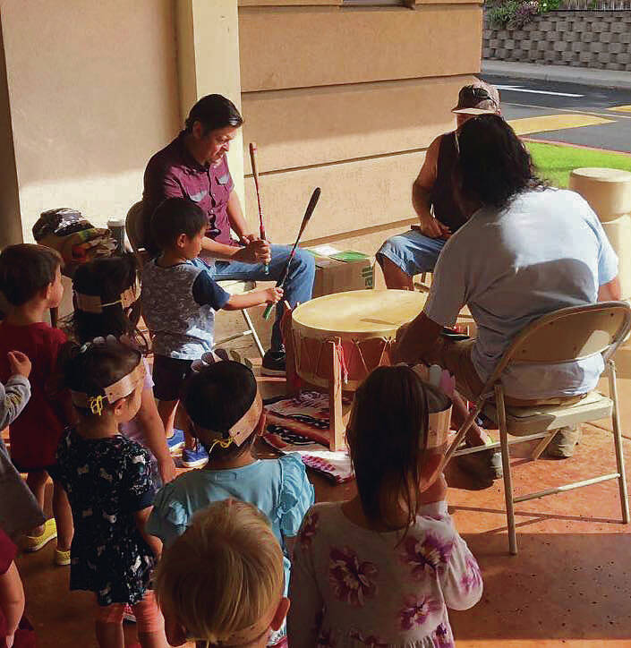 COURTESY OAHU INTERTRIBAL COUNCIL / 2019
                                Members of the 808NDNZ drum group lead cultural demonstrations to preschoolers at Star of the Sea.