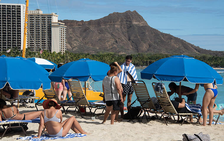 CRAIG T. KOJIMA / CKOJIMA@STARADVERTISER.COM
                                On Waikiki Beach, there appeared to be fewer people enjoying the good weather on Sept. 1.