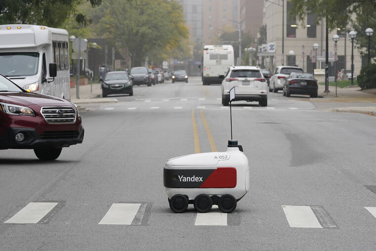 ASSOCIATED PRESS
                                A food delivery robot crossed a street in Ann Arbor, Mich. Oct. 7. Robot food delivery is no longer the stuff of science fiction. Hundreds of little robots — knee-high and able to hold around four large pizzas — are now navigating college campuses and even some city sidewalks in the U.S., the U.K. and elsewhere.