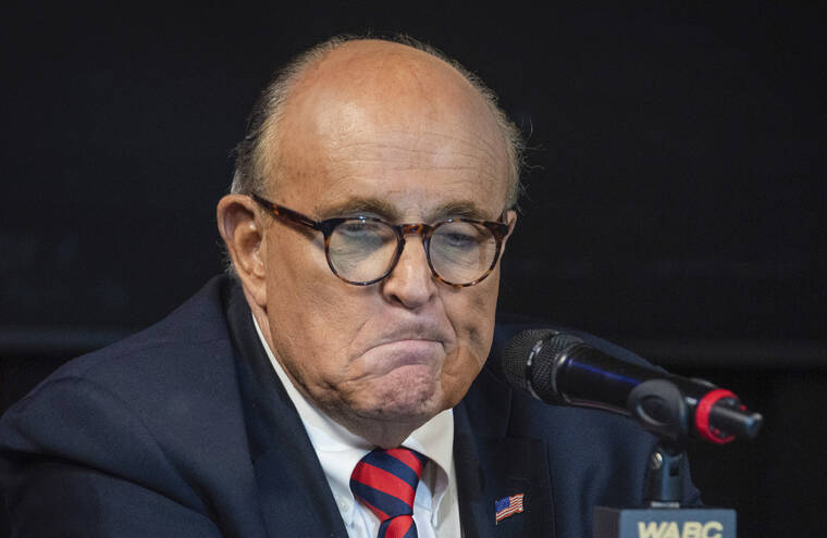 ASSOCIATED PRESS / SEPT. 10
                                Former New York City Mayor Rudy Giuliani reacts during a talk radio show at the WABC studios in New York.
