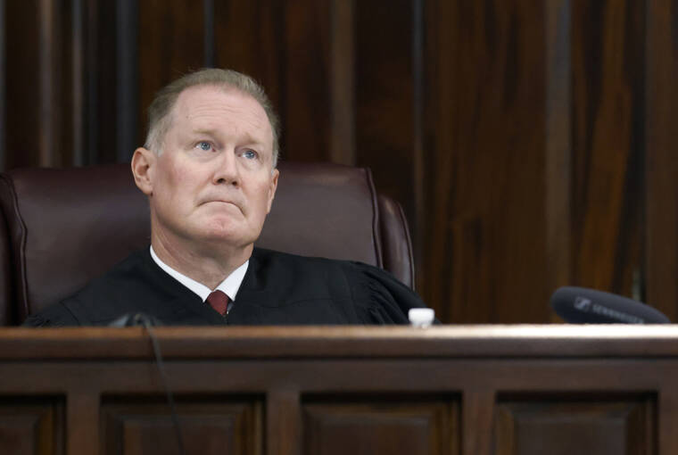 OCTAVIO JONES/POOL PHOTO VIA AP / OCT. 27
                                Judge Timothy Walmsley presides over the jury selection process in the trial of Gregory McMichael, Travis McMichael, and their neighbour, William “Roddie” Bryan, charged with the February 2020 death of 25-year-old Ahmaud Arbery, at the Gwynn County Superior Court, in Brunswick, Ga.