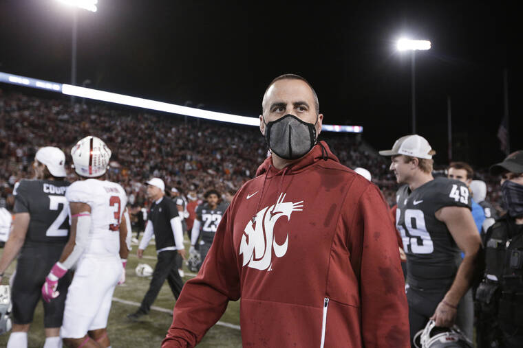ASSOCIATED PRESS
                                Washington State coach Nick Rolovich walks on the field after the team’s game against Stanford on Oct. 16.