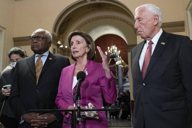 ASSOCIATED PRESS
                                Speaker of the House Nancy Pelosi, D-Calif., accompanied by House Majority Whip James Clyburn, D-S.C., left and House Majority Leader Steny Hoyer D-Md. speaks to reporters at the Capitol in Washington, today, as the House is considering President Joe Biden’s $1.85 trillion-and-growing domestic policy package.