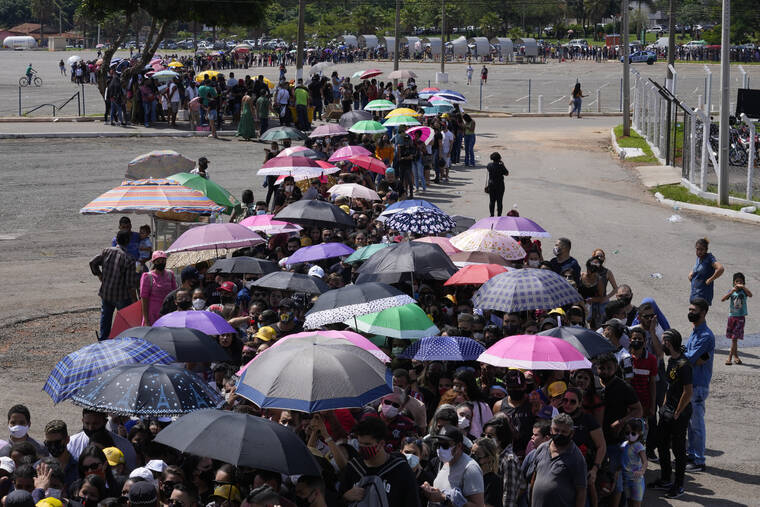 ASSOCIATED PRESS
                                Fans wait in line to pay their final respects to Brazilian singer Marilia Mendonca, during a wake at the Ginasio Arena in Goiania, Brazil. One of Brazil’s most popular singers and a Latin Grammy winner, Mendoca died Friday in an airplane crash on her way to a concert. She was 26.