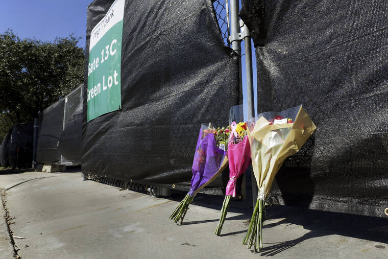 ASSOCIATED PRESS
                                Flowers lie against the south fence surrounding the Astroworld festival grounds the day after several people died and scores were injured during a concert the night before at NRG Park on Saturday in Houston.