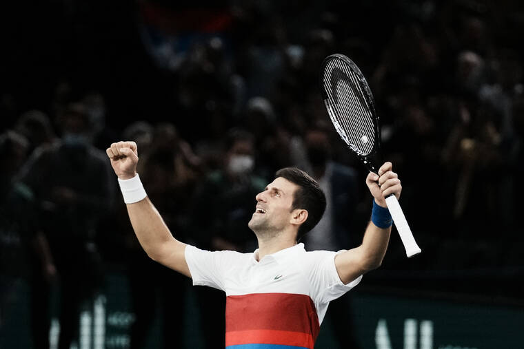 ASSOCIATED PRESS
                                Serbia’s Novak Djokovic celebrates defeating Russia’s Daniil Medvedev during the final match of the Paris Masters tennis tournament at the Accor Arena in Paris today. Djokovic won 4-6, 6-3, 6-3.