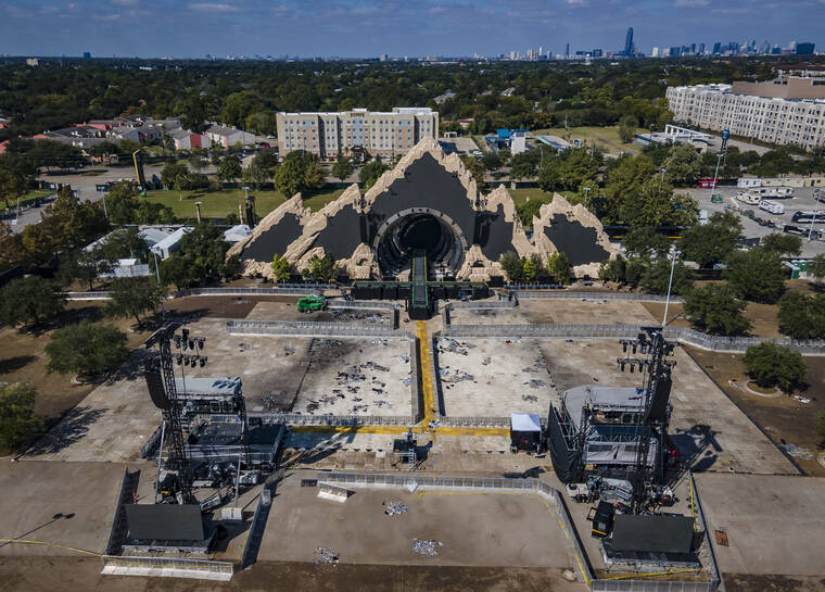 HOUSTON CHRONICLE VIA AP
                                The Astroworld main stage where Travis Scott was performing Friday evening where a surging crowd killed eight people, sits full of debris from the concert, in a parking lot at NRG Center on Monday.