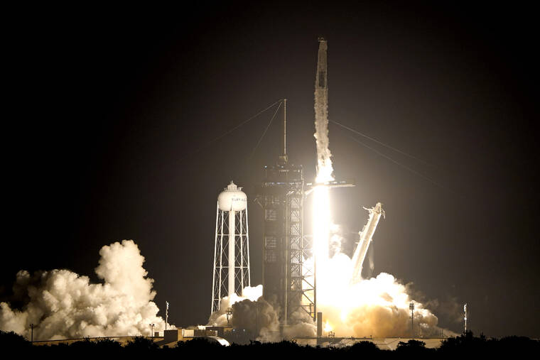 ASSOCIATED PRESS
                                A SpaceX Falcon 9 rocket with the Crew Dragon capsule lifts off from Launch Pad 39A at the Kennedy Space Center in Cape Canaveral, Fla.