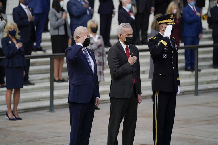 ASSOCIATED PRESS
                                President Joe Biden saluted as he stood with Veterans Affairs Secretary Denis McDonough and Army Maj. Gen. Allan M. Pepin during a wreath-laying ceremony to commemorate Veterans Day and mark the centennial anniversary of the Tomb of the Unknown Soldier at Arlington National Cemetery, today, in Arlington, Va. First lady Jill Biden is at left.