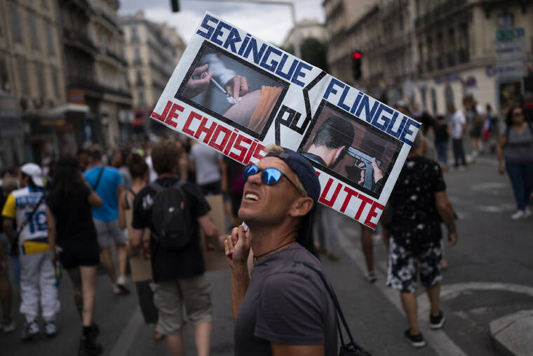 ASSOCIATED PRESS
                                A protester marched with a sign reading in French “syringe or gun” during an anti-lockdown demonstration in Marseille, southern France, Aug. 7. The pandemic is again roaring across parts of Western Europe, a prosperous region with relatively high vaccination rates and good health care systems but where lockdown measures to rein in the virus are largely a thing of the past.