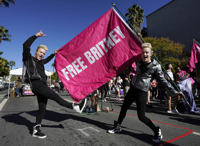 ASSOCIATED PRESS
                                Twins Edward, right, and John Grimes of Dublin, Ireland, held a “Free Britney” flag outside a hearing concerning the pop singer’s conservatorship at the Stanley Mosk Courthouse, today, in Los Angeles.