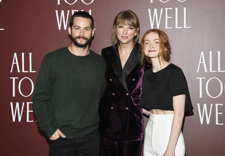 ASSOCIATED PRESS
                                Actor Dylan O’Brien, left, writer-director Taylor Swift and actor Sadie Sink pose together at a premiere for the short film “All Too Well” at AMC Lincoln Square 13 today in New York.