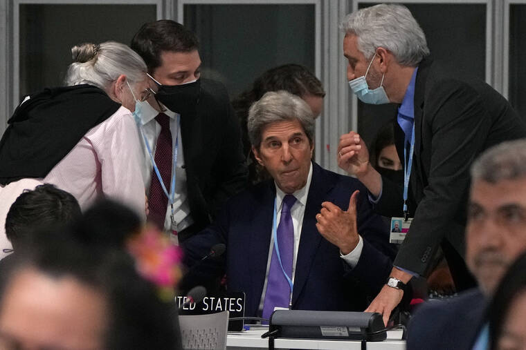ASSOCIATED PRESS
                                John Kerry, U.S. Special Presidential Envoy for Climate, center, confers during a stocktaking plenary session at the COP26 U.N. Climate Summit in Glasgow, Scotland today.