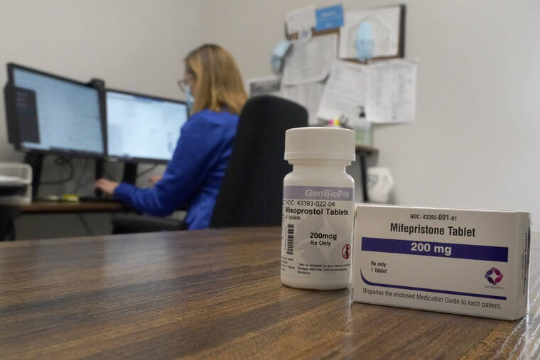 ASSOCIATED PRESS / OCT. 29
                                A nurse practitioner works in an office at a Planned Parenthood clinic where she confers via teleconference with patients seeking self-managed abortions as containers of the medication used to end an early pregnancy sits on a table nearby last month in Fairview Heights, Ill. Women with unwanted pregnancies are increasingly considering getting abortion pills by mail.