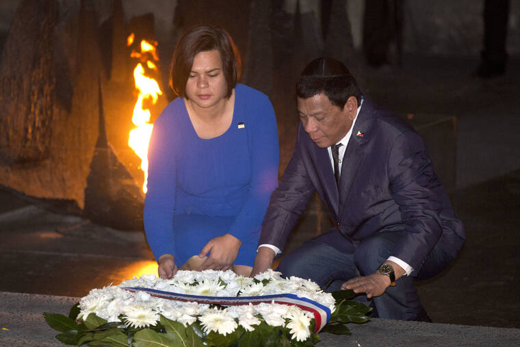 ASSOCIATED PRESS / SEPT. 3, 2018
                                Philippine President Rodrigo Duterte and his daughter Sara lay a wreath during a memorial ceremony at the Yad Vashem Holocaust Memorial in Jerusalem on Sept 3, 2018. Sara Duterte registered her candidacy today for vice president in next year’s elections and was adopted as the running mate of presidential candidate Ferdinand Marcos Jr., the son of the late Filipino dictator, in an alliance that immediately set off alarms among human rights activists.