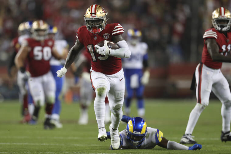 ASSOCIATED PRESS
                                San Francisco 49ers wide receiver Deebo Samuel ran past Los Angeles Rams safety Jordan Fuller to score during the second half of a game in Santa Clara, Calif., Monday.