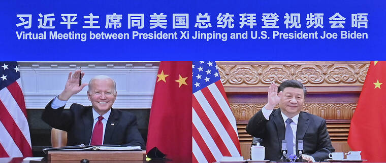 YUE YUEWEI/XINHUA VIA ASSOCIATED PRESS
                                Chinese President Xi Jinping, right and President Joe Biden appeared on a screen as they held a meeting via video link, in Beijing, China, Tuesday. President Joe Biden opened his virtual meeting with China’s President Xi Jinping by saying the goal of the two world leaders should be to ensure that competition between the two superpowers “does not veer into conflict.”