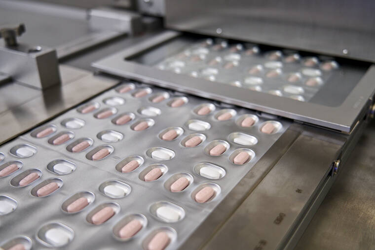PFIZER VIA ASSOCIATED PRESS
                                Pfizer showed its COVID-19 pills. Drugmaker Pfizer said, today, it is submitting its experimental pill for U.S. authorization, setting the stage for a likely launch in coming weeks.