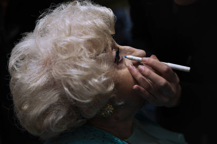 ASSOCIATED PRESS
                                Holocaust survivor, Kuka Palmon, 87, gets make-up applied during a special beauty pageant honoring Holocaust survivors in Jerusalem. Ten contestants participated in the “Miss Holocaust Survivor” pageant, which was held for the first time since 2019 after being suspended due to the coronavirus pandemic.