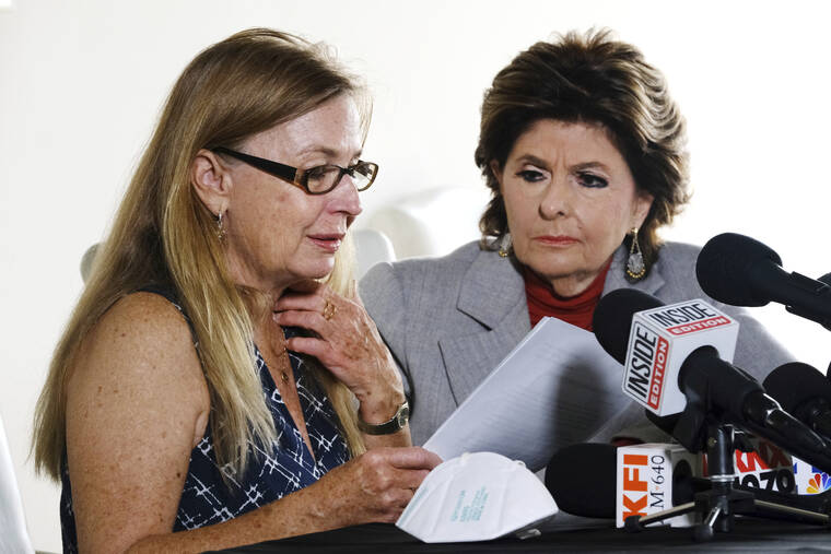 ASSOCIATED PRESS
                                Script Supervisor Mamie Mitchell reads a statement, left, as she is joined by her attorney Gloria Allred during a news conference in Los Angeles. Allred announced a lawsuit on behalf of Mitchell, who was on set when a prop gun being used by Alec Baldwin went off, killing cinematographer Halyna Hutchins and wounding the film’s director.