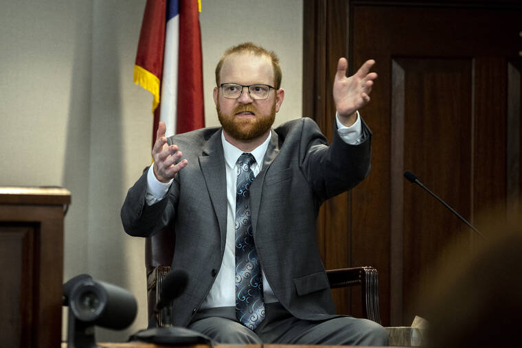STEPHEN B. MORTON, POOL VIA AP / NOV. 17
                                Travis McMichael speaks from the witness stand during his trial in Brunswick, Ga. McMichael, his father Greg McMichael and their neighbor, William “Roddie” Bryan, are charged with the February 2020 death of 25-year-old Ahmaud Arbery.