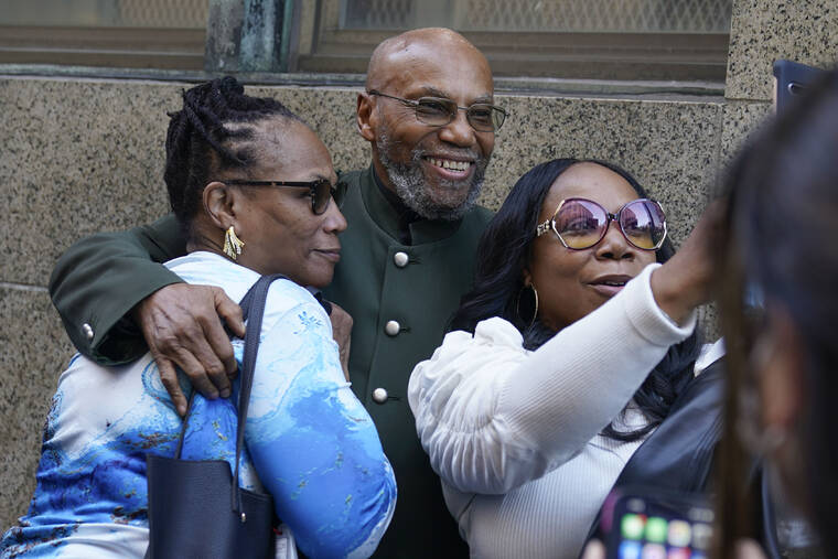 ASSOCIATED PRESS
                                Muhammad Aziz, center, stands outside the courthouse with members of his family after his conviction in the killing of Malcolm X was vacated today in New York. A Manhattan judge dismissed the convictions of Aziz and the late Khalil Islam after prosecutors and the men’s lawyers said a renewed investigation found new evidence that the men were not involved with the killing and determined that authorities withheld some of what they knew.
