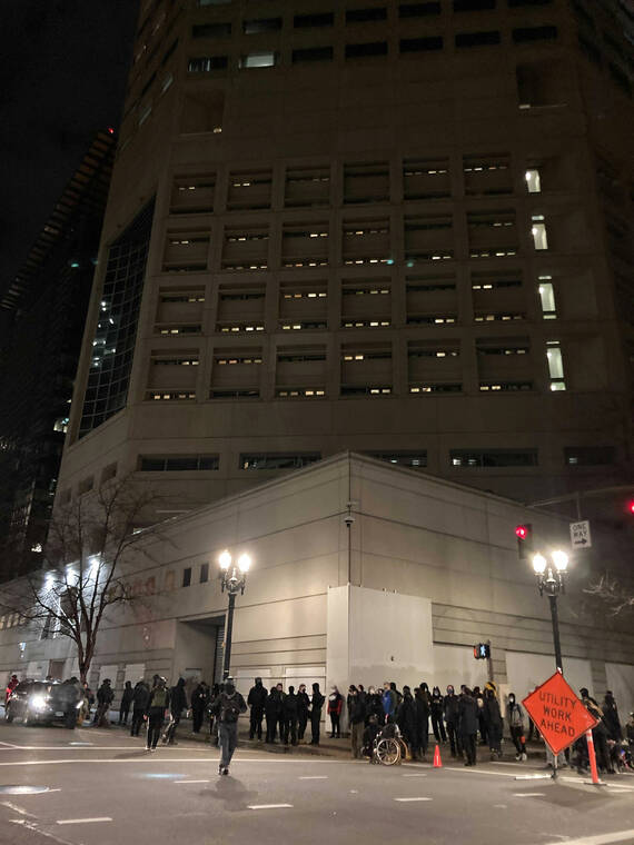 MARK GRAVES/THE OREGONIAN VIA AP
                                About 100 people gathered in downtown Portland, Ore., near the Multnomah County Justice Center to protest against the Kyle Rittenhouse verdict, occasionally chanting and mostly milling about in and along Southwest Main Street.