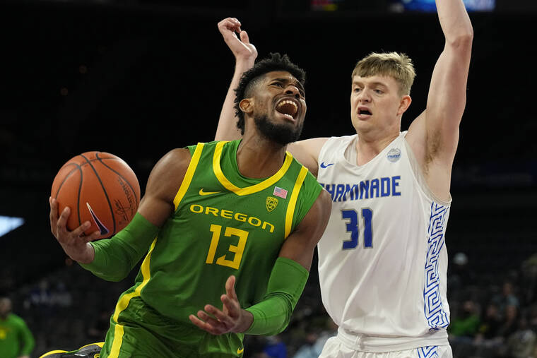 ASSOCIATED PRESS
                                Oregon forward Quincy Guerrier drives against Chaminade center Joseph Smoyer (31) in the first half during an NCAA college basketball game at the Maui Invitational in Las Vegas Monday.