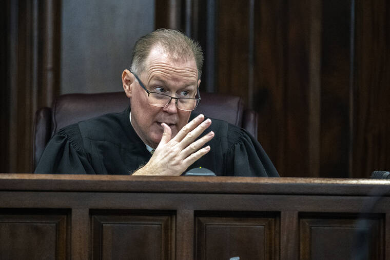 ASSOCIATED PRESS
                                Superior Court Judge Timothy Walmsley clarifies a jury request to view a short video clip as part of their deliberation during the trial of Greg McMichael, his son Travis McMichael, and neighbor, William “Roddie” Bryan in the Glynn County Courthouse in Brunswick, Ga. The three are charged with the February 2020 slaying of 25-year-old Ahmaud Arbery.