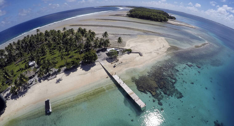 ASSOCIATED PRESS
                                An aerial photo showed a small section of the atoll that has slipped beneath the waterline, only showing a small pile of rocks at low tide on Majuro Atoll in the Marshall Islands, in November 2015. For decades, the tiny Marshall Islands has been a stalwart American ally. Its location in the middle of the Pacific Ocean has made it a key strategic outpost for the U.S. military.