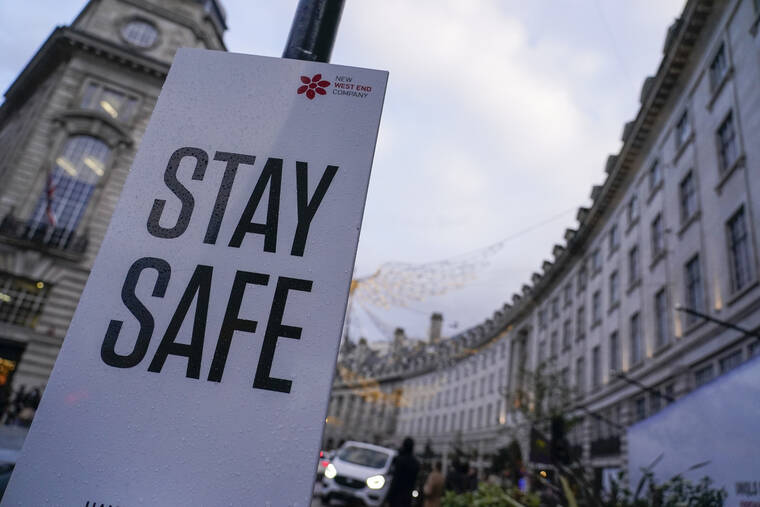 ASSOCIATED PRESS / NOV. 26
                                A sign reading ‘Stay safe’ in Regent Street, in London. A slew of nations moved to stop air travel from southern Africa on Friday, and stocks plunged in Asia and Europe in reaction to news of a new, potentially more transmissible COVID-19 variant.