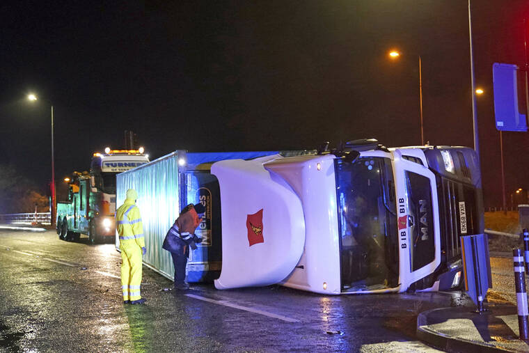 OWEN HUMPHREYS/PA VIA AP / NOV. 27
                                A truck lies on its side after being blown over by gusts of wind of almost 100 miles (160 km) per hour which battered some areas of the country during Storm Arwen, in Hartlepool, England. The Met Office issued a rare red warning for wind from 3pm on Friday to 2am on Saturday as the first winter storm was set to batter the country.