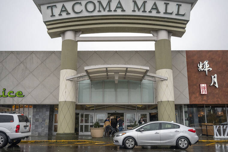 PETE CASTER/THE NEWS TRIBUNE VIA AP
                                People walk into the north entrance of the Tacoma Mall in Tacoma, Wash. A day earlier, multiple shots were fired inside the mall. One person was injured in the shooting.