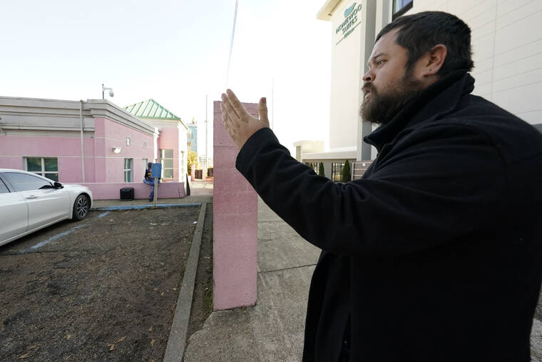 ASSOCIATED PRESS
                                Pastor Keith Dalton, of the Church at Jackson, calls out to women entering the “pink house,” the nickname of Jackson Women’s Health Organization, a state-licensed abortion clinic in Jackson, Miss.
