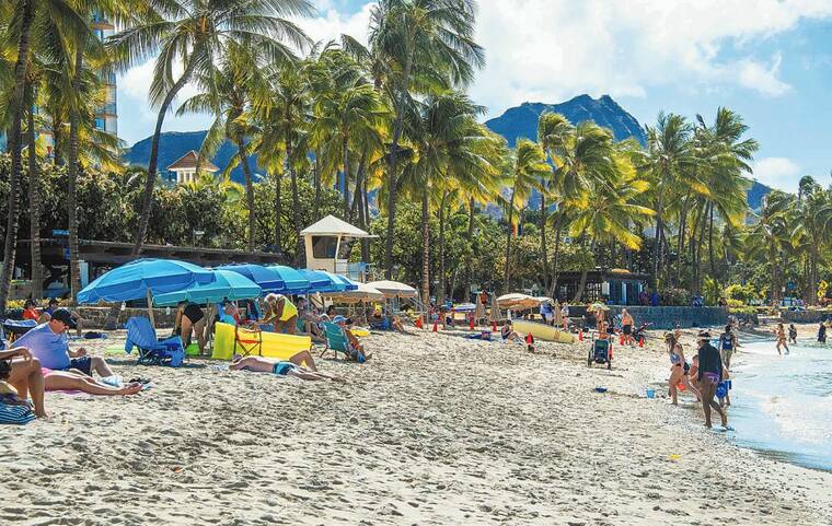 CRAIG T. KOJIMA / OCT. 15
                                October visitor arrivals to Hawaii fell 30.8% from the same month in 2019, according to the Department of Business, Economic Development and Tourism. Shown here, Waikiki Beach had plenty of room for tourists in mid-October.