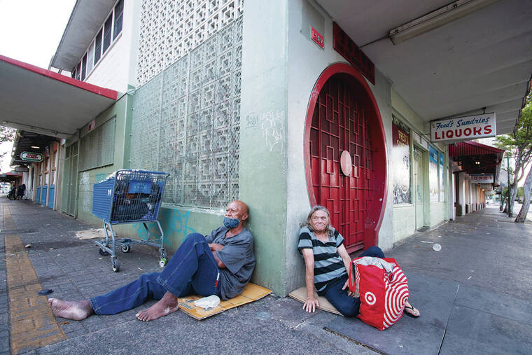 STAR-ADVERTISER
                                Homeless people gathered on a Chinatown sidewalk in June 2020.