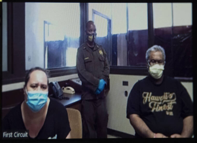 CRAIG T. KOJIMA / NOV. 12
                                Adoptive parents Lehua Kalua and Isaac Kalua, both charged with second-degree murder in connection the disappearance of 6-year-old Isabella Kalua in Waimanalo.