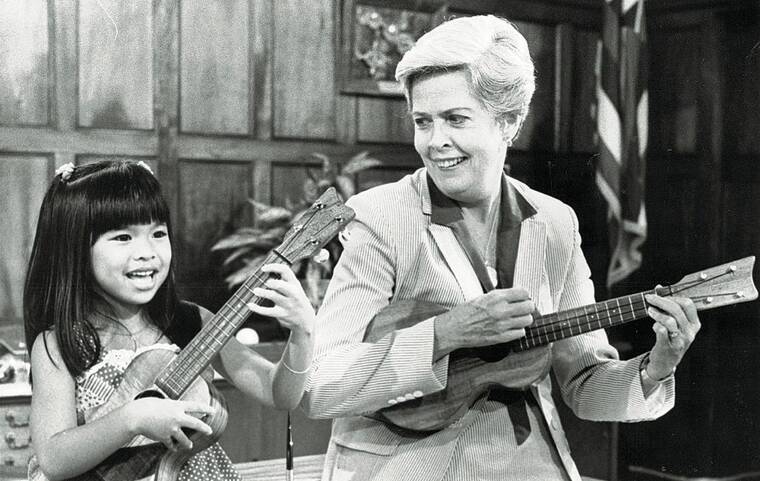 STAR-ADVERTISER / JULY 1982
                                Ukulele whiz Sheri-Lyn Cabbab taught Honolulu Mayor Eileen Anderson a few tunes. Anderson died on Nov. 3rd at the age of 93.