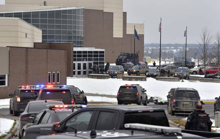 TODD MCINTURF/THE DETROIT NEWS VIA ASSOCIATED PRESS
                                Dozens of police, fire and EMS personnel worked on the scene of a shooting at Oxford High School, today, in Oxford Township, Mich.
