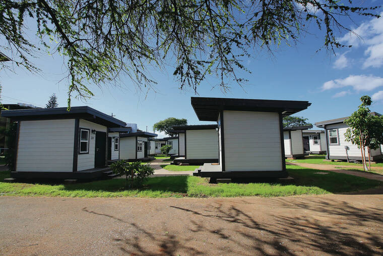 JAMM AQUINO / JAQUINO@STARADVERTISER.COM
                                Kama‘oku, the new “kauhale” housing project in Kalealoa, features 37 homes. The 100-square-foot homes were designed to face each other to promote a sense of community among residents. Each resident is expected to pay $500 a month in rent.