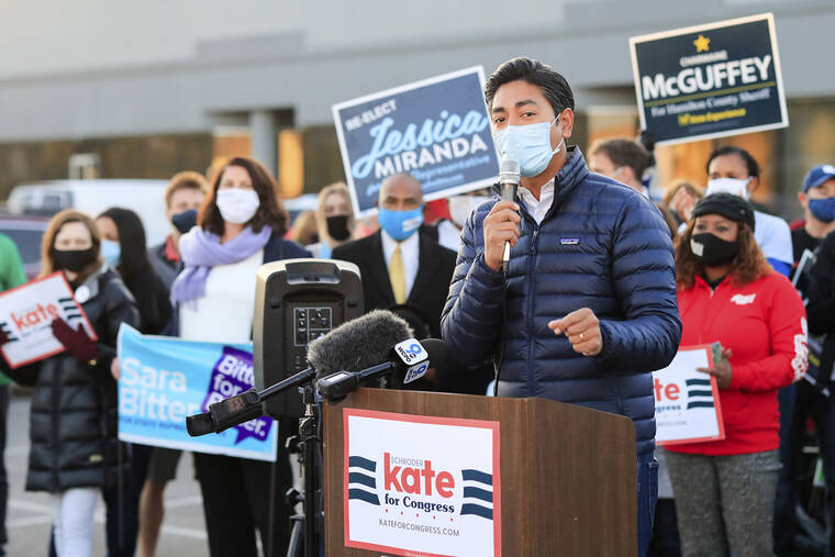 ASSOCIATED PRESS
                                Aftab Pureval speaks at the Hamilton County Board of Elections as people arrive to participate in early voting on Oct. 6, 2020, in Norwood, Ohio.