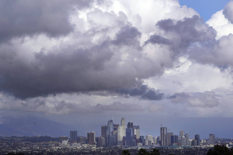 ASSOCIATED PRESS / MARCH 10
                                Rain clouds hover over the downtown skyline in Los Angeles.