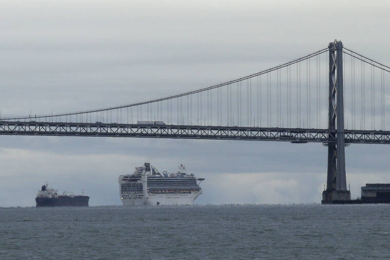 ASSOCIATED PRESS / 2020
                                Framed by the San Francisco-Oakland Bay Bridge, a cruise ship makes its way to an anchorage, in San Francisco. A San Francisco police officer was charged today with voluntary manslaughter.