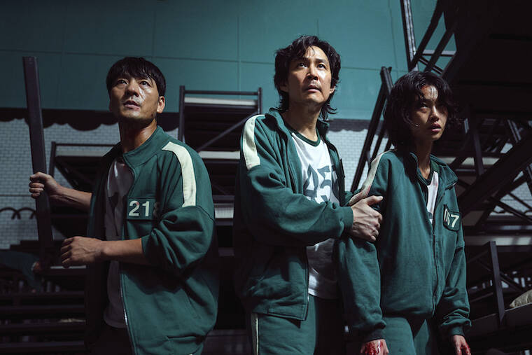 COURTESY NETFLIX
                                South Korean cast members, from left, Park Hae-soo, Lee Jung-jae and Jung Ho-yeon in a scene from “Squid Game.”