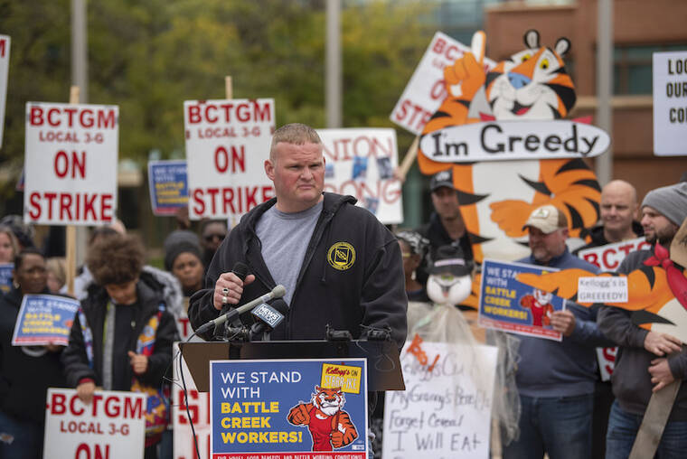 ALYSSA KEOWN/BATTLE CREEK ENQUIRER VIA AP / OCT. 27
                                Trevor Bidelman, president of the BCTGM Local 3-G, speaks during a rally outside Kellogg’s World Headquarters to support workers on strike in Battle Creek, Mich.