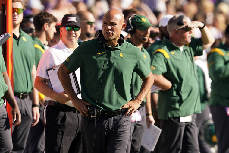 ASSOCIATED PRESS
                                Baylor head coach Dave Aranda, center, talks to an official standing nearby during a game against TCU on Nov. 6.