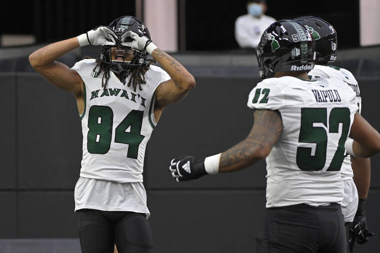 ASSOCIATED PRESS
                                Hawaii wide receiver Nick Mardner celebrates after scoring at touchdown against UNLV during the first half of an NCAA college football game Saturday in Las Vegas.