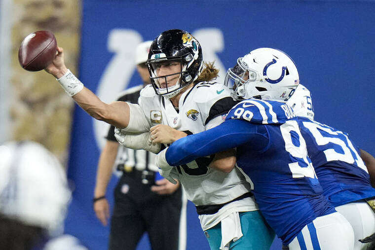 ASSOCIATED PRESS
                                Jacksonville Jaguars quarterback Trevor Lawrence was hit by Indianapolis Colts defensive tackle DeForest Buckner in the second half of an NFL football game in Indianapolis, Sunday.
